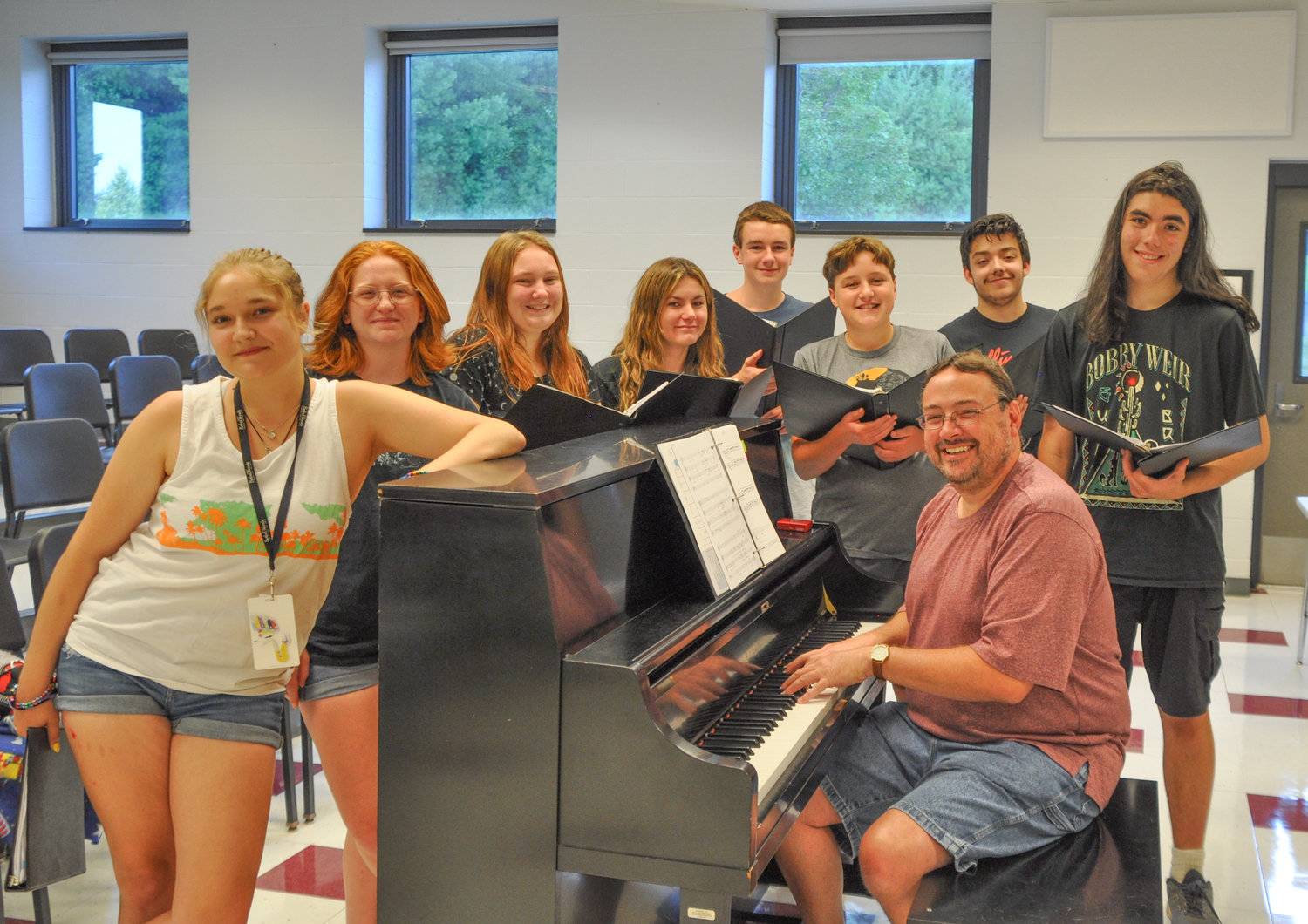 Sullivan West Select Choir director Jerry Hoch rehearses with some of the choral group's members in anticipation of their appearance on August 7 at Bethel Woods. The choir will perform before Foreigner takes the stage.